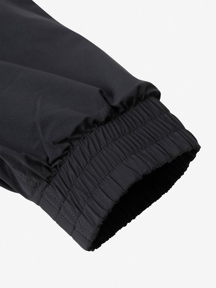 The hem and cuffs feature a classic shirring design